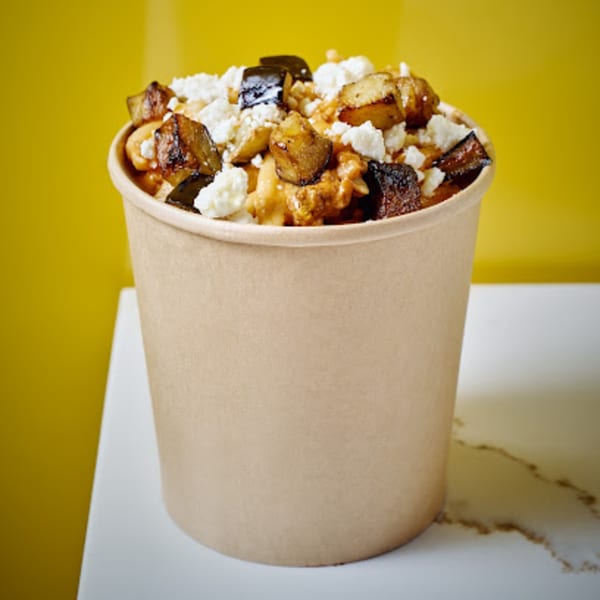 Pasta Lab NYC's pasta in a cup, topped with roasted eggplant and crumbled cheese.